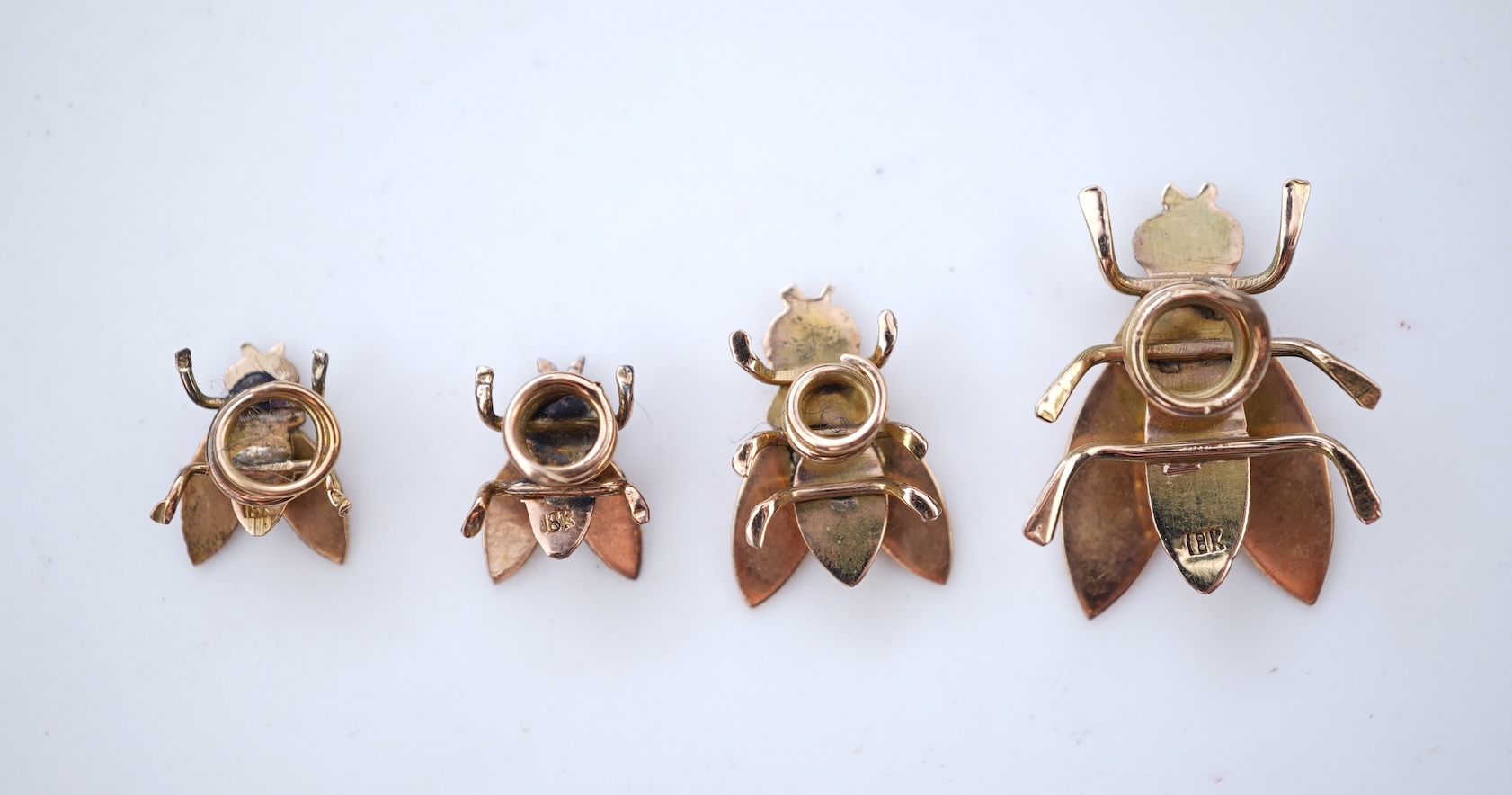 A set of four Retro gold and enamel buttons, mid 20th century
